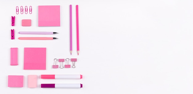 Flat lay pink items with copy-space