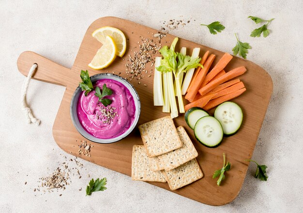 Flat lay of pink sauce with vegetables