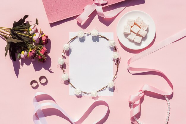 Flat lay pink wedding arrangement with on background