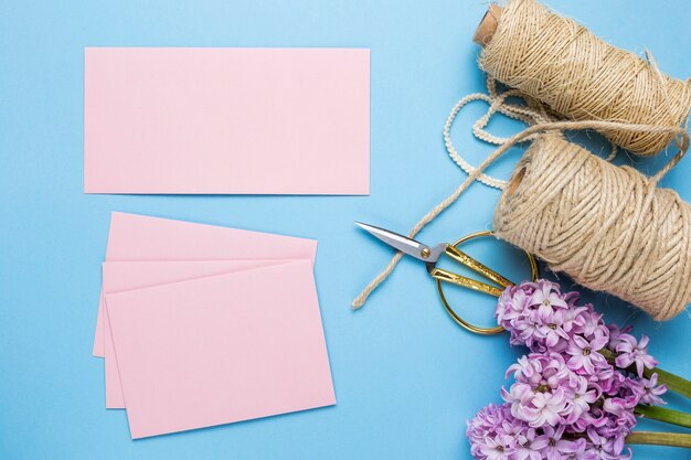 Flat lay pink wedding invitations 