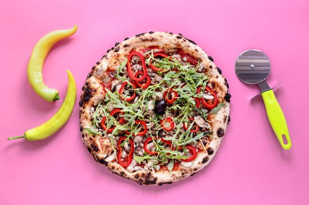 Flat lay pizza on pink background