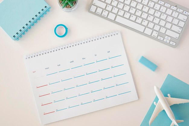 Flat lay planner calendar with blue accessories