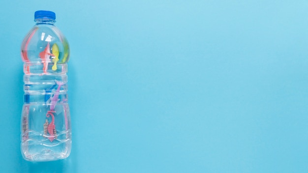 Flat lay of plastic bottle with copy space