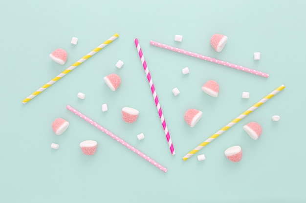 Flat lay plastic straws and jellies