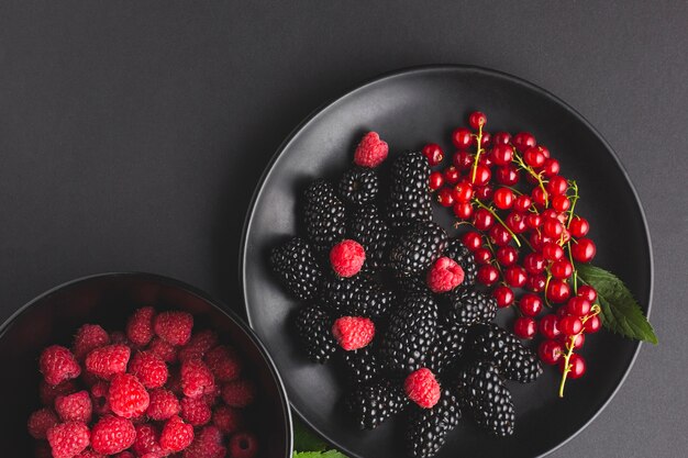 Flat-lay plate and bowl of fresh berries