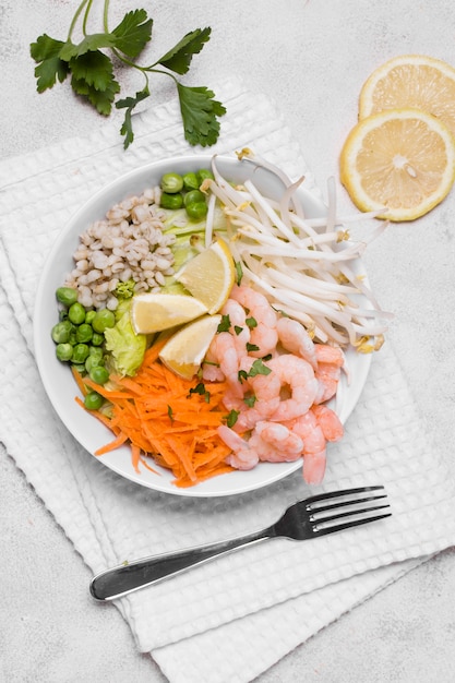 Flat lay of plate of shrimp and vegetables