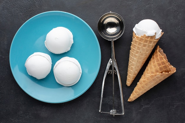 Free photo flat lay plate with ice cream cups