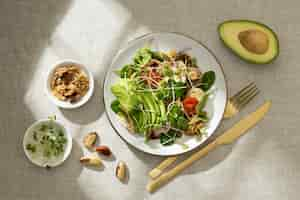 Free photo flat lay of plate with keto diet food and nuts