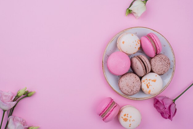 Flat lay of plate with macarons and copy space