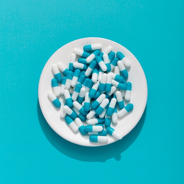 Flat lay of plate with multiple pills