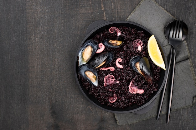 flat lay of plate with pasta and mussels