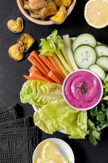 Flat lay of plate with vegetables and other food