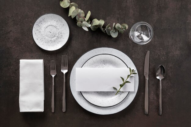 flat lay plates, cutlery and glass