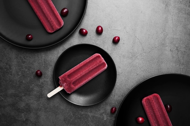 Flat lay plates with ice cream on stick