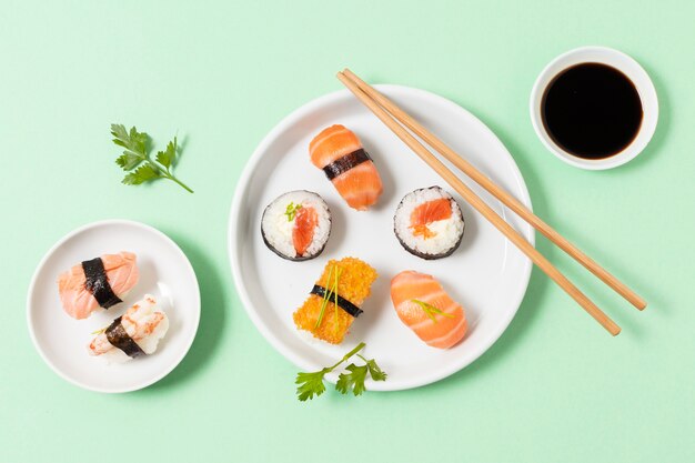 Flat lay plates with sushi