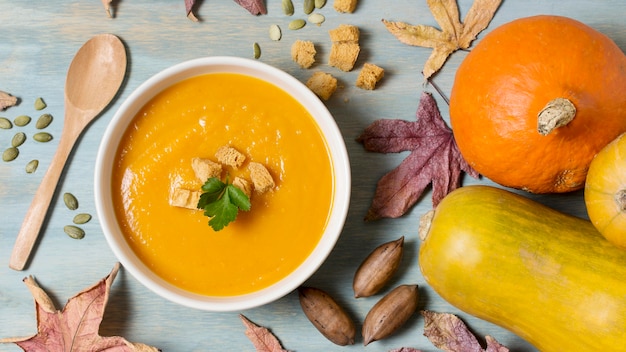 Free photo flat lay pumpkin cream soup arrangement