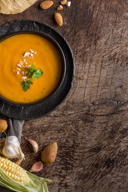 Flat lay pumpkin cream soup in bowl