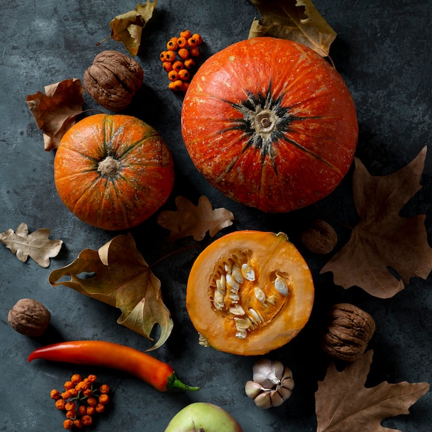 Flat lay pumpkins and autumn leaves