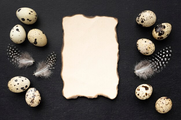 Flat lay quail eggs with paper piece