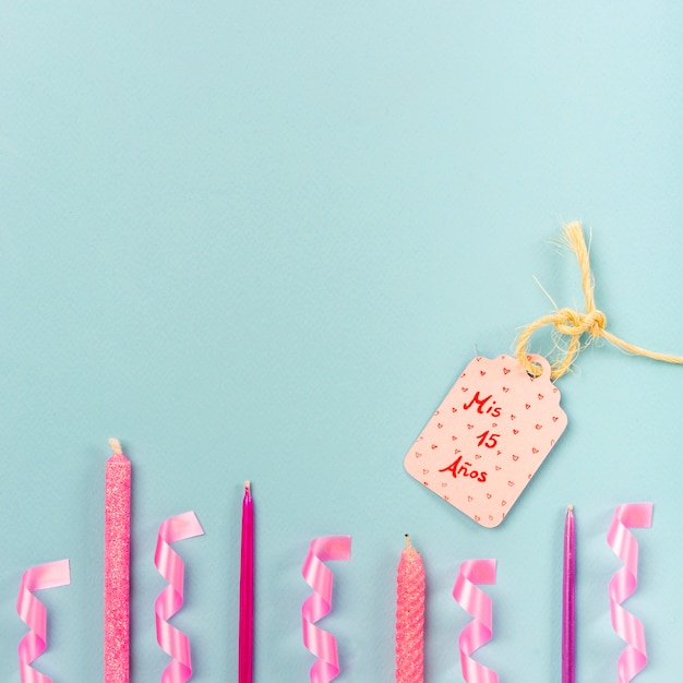 Flat lay quinceañera arrangement with birthday tag