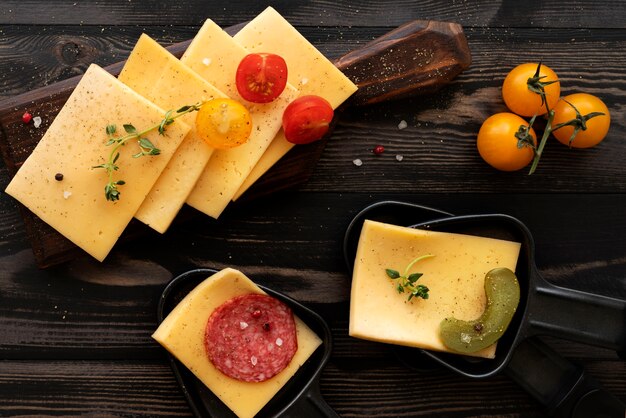 Flat lay of raclette dish with delicious food assortment