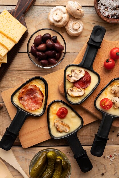 Flat lay of raclette dish with ingredients and delicious food