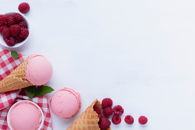 Free photo flat lay of raspberries ice cream with copy space