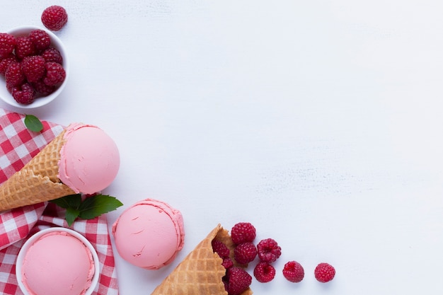 Flat lay of raspberries ice cream with copy space