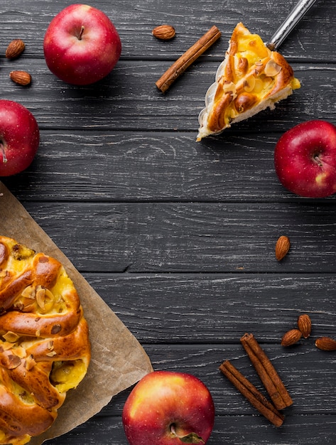 Flat lay red apples and pie with copy space