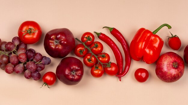 Flat lay red fruits and vegetables