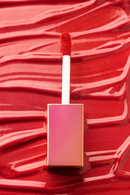 Flat lay red lip gloss texture