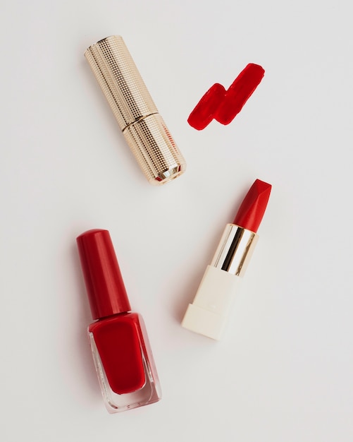 Flat lay red lipstick on white background