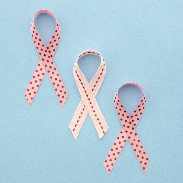 Flat lay ribbons with dots on blue background