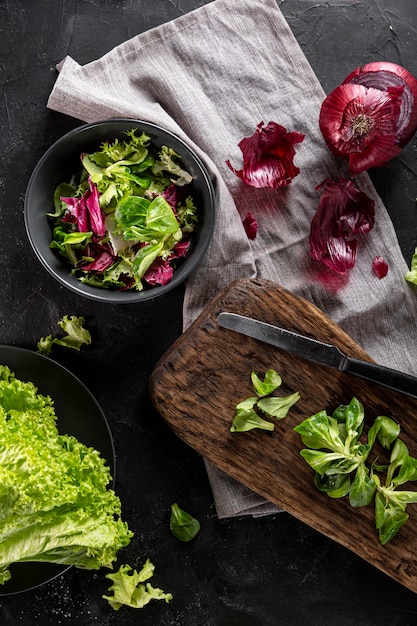 Flat lay salad arrangement on white cloth