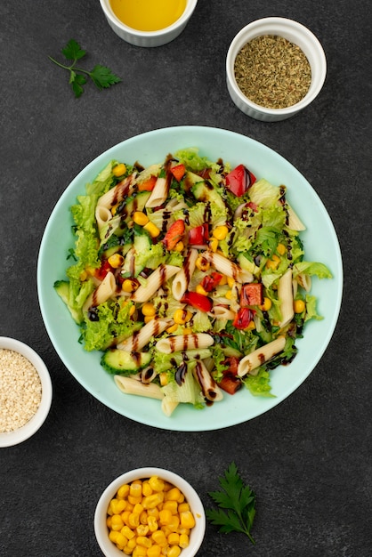 Flat lay salad with chicken and balsamic vinegar