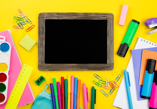 Flat lay of school essentials with colored pencils