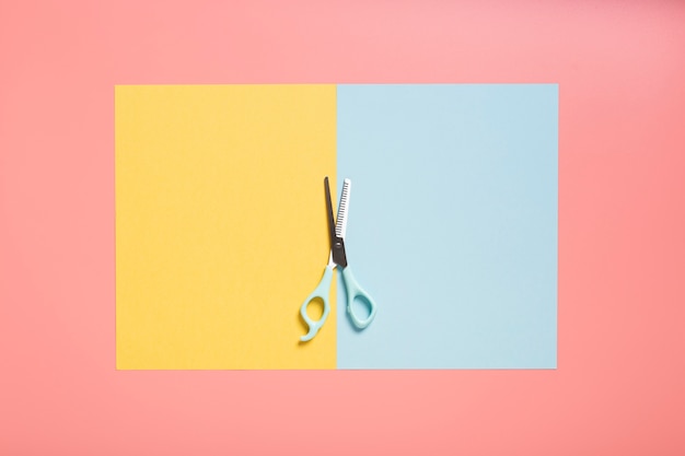 Flat lay of scissors on plain background