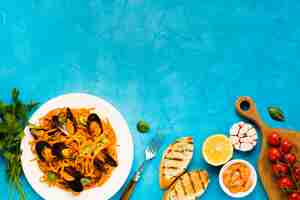 Free photo flat-lay seafood dishes with copyspace