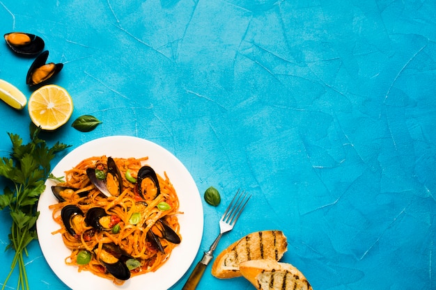 Flat-lay seafood dishes with copyspace