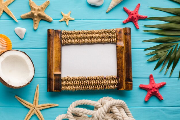 Flat lay seaside composition with picture frame