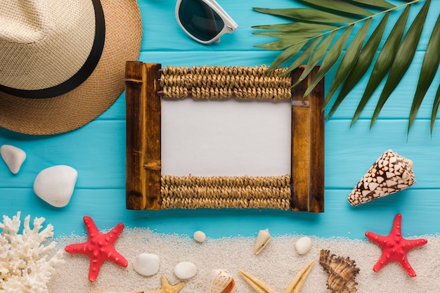 Flat lay seaside composition with picture frame