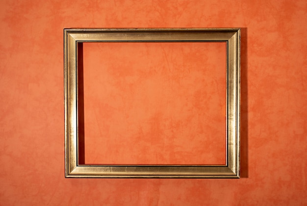 Flat lay shiny frame on orange background