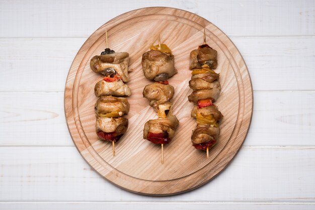 Flat lay skewers on wooden board