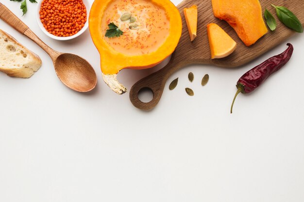 Free photo flat lay sliced pumpkin lentil and ingredients with copy space