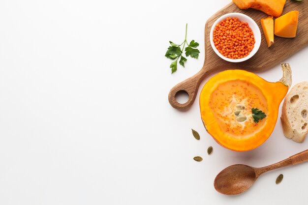 Flat lay sliced pumpkin and lentil with copy space