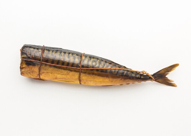 Flat lay smoked fish on white background