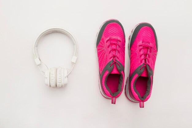 Flat lay of sneakers with headphones