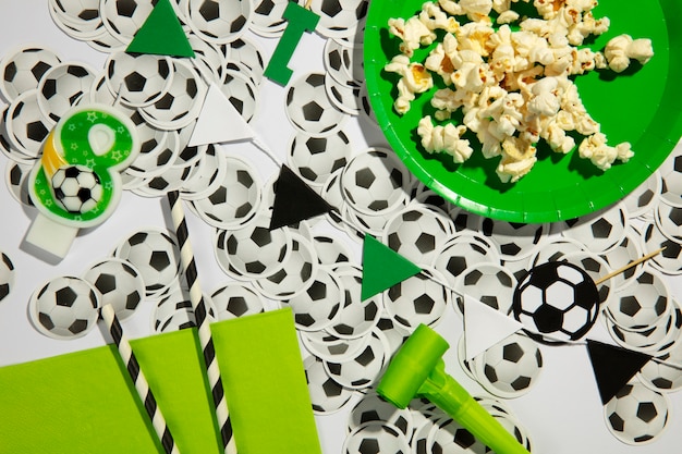 Free photo flat lay soccer birthday with decorations