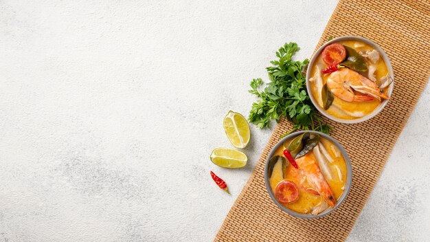 Flat lay soup in bowls with copy space