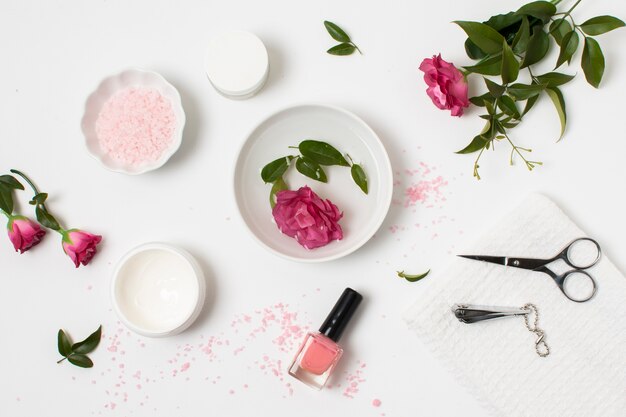 Flat lay spa concept with nail polish and rose 